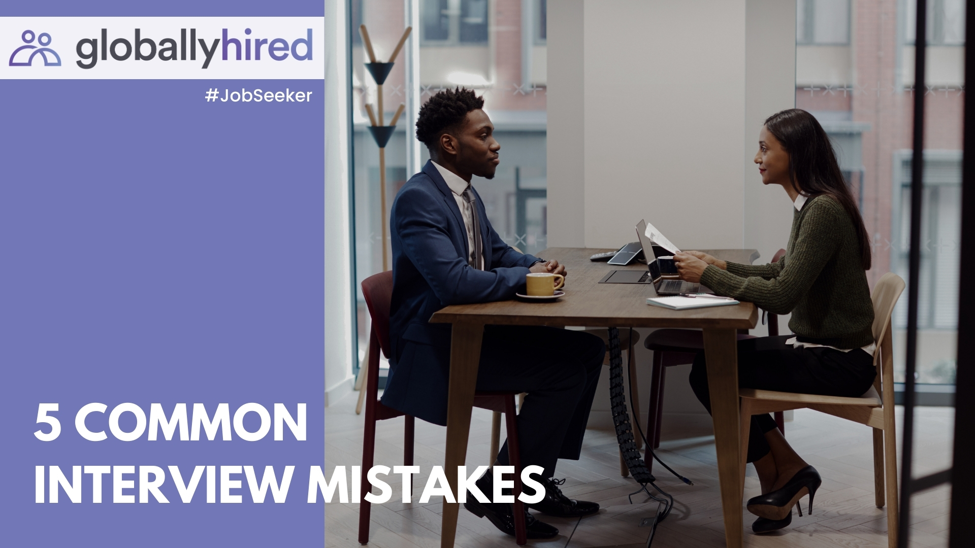 business professional man and woman sitting at a table having a job interview.