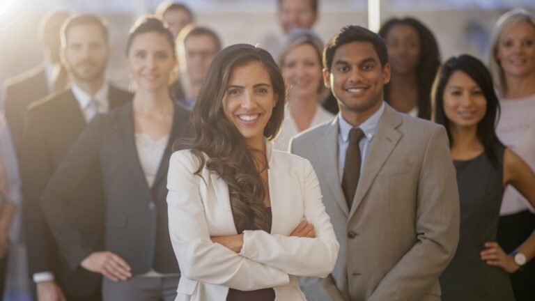 Group of professionals standing together at an on-demand staffing agency, GloballyHired.